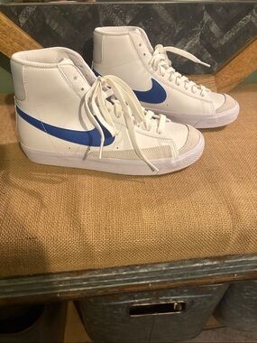 Nike Women's White High-Top Sneakers with Blue Swoosh